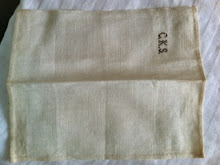 oid0830: Handkerchief.  Small rectangular handkerchief handstitched rolled hem on 4 sides.  Initials in brown cross stitch:  "C.K.S."